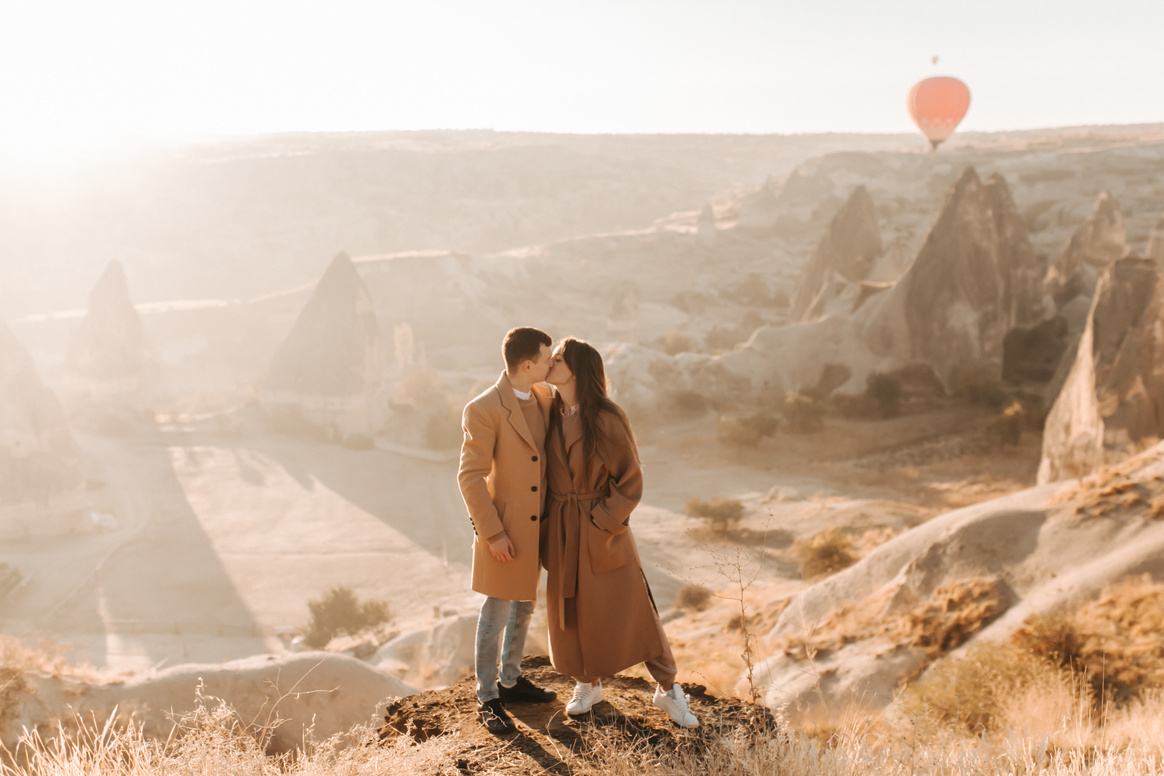 Couple Wearing Brown Coat Kissing